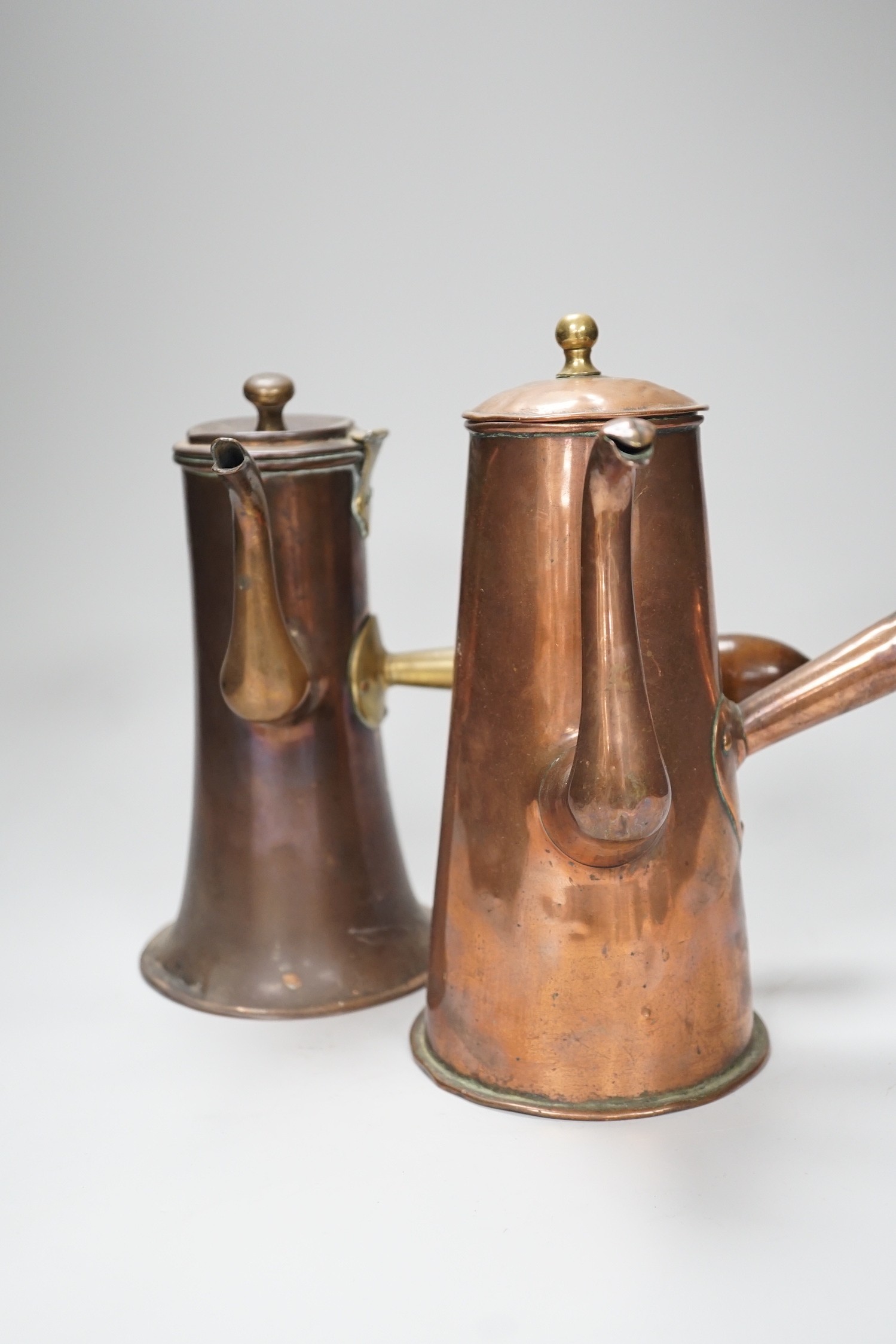 Two 18th century copper tavern coffee pots. Tallest 22.5cm